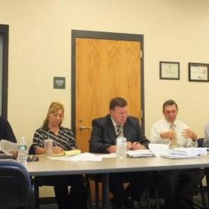 The Board met in Wiscasset July 10 for an all-day workshop at Two Bridges Regional Jail. Left to right, Executive Director Michael Tausek, Aroostock County Commissioner Douglas Beaulieu, Edgecomb Selectman Stuart Smith, Department of Corrections Executive Assistant Jane Tower, Spring Harbor Hospital Chief Operating Officer Ric Hanley, York County Commissioner David Bowles, Department of Corrections Commissioner Joseph Ponte and Department of Profession and Financial Regulation Commissioner Ann Head. CHARLOTTE BOYNTON/ Wiscasset Newspaper