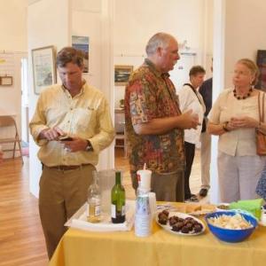 Art patrons enjoy some refreshments and art at the Maine Art Gallery's Marine Art exhibit on opening night. Art patrons enjoy some refreshments and art at the Maine Art Gallery's Marine Art exhibit on opening night.