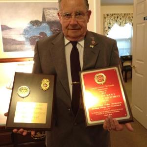 Arthur Richardson holds the Bob Maxcy Lifetime Achievement Award and a plaque he received from the Boothbay Harbor Rotary Club in 2004 for his years of service to the Boothbay Harbor Fire Department.