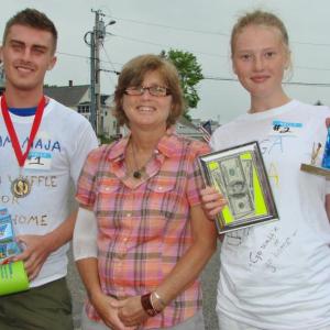 The first and second place winners of Wannawaf's eighth annual waffle-eating contest Anton and Maja Ekman with the recipient of the fundraising event Pam Creamer, center, who suffers from chronic Lyme disease. LISA KRISTOFF/Boothbay Register