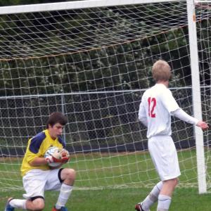 Nate Mills makes a save with St. Doms. KATHY ONORATO/Wiscasset Newspaper