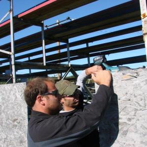 r. of West Gardiner applies paint. SUSAN JOHNS/Wiscasset Newspaper 
