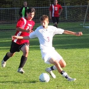 JD Souza makes his move past a Lisbon defender in Wiscasset’s game with Lisbon. Below, Zack Ellison gets up high and heads the ball in Mountain Valley Conference action, and Nate Mills makes a save with St. Doms. KATHY ONORATO/Wiscasset Newspaper JD Souza makes his move past a Lisbon defender in Wiscasset’s game with Lisbon. KATHY ONORATO/Wiscasset Newspaper