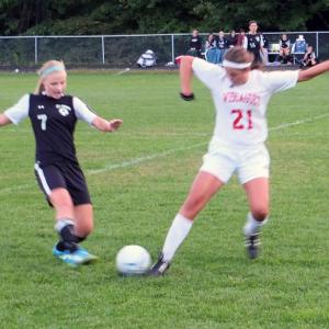 Miranda McIntire moves the ball in Wiscasset’s double overtime game with St. Dom. Below, Alecia Faulkingham takes the ball downfield. KATHY ONORATO/Wiscasset Newspaper Miranda McIntire moves the ball in Wiscasset’s double overtime game with St. Dom. KATHY ONORATO/Wiscasset Newspaper