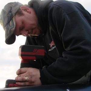 Dan Nessmith of Wiscasset works on his race car, hours before racing got underway. SUSAN JOHNS/Wiscasset Newspaper