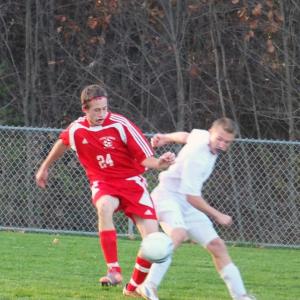 Dale Peaslee gets around a St. Dom’s player in tournament action. KATHY ONORATO/Wiscasset Newspaper 