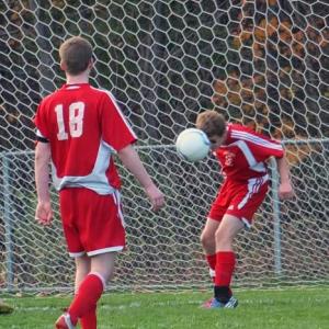 Camden Reiss heads the ball, keeping it out of the net. KATHY ONORATO/Wiscasset Newspaper 