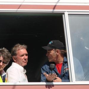 Speedway owners Vanessa Jordan, left, and Richard Jordan hear from race organizer Dale Chadbourne, far right, of Woolwich as the three meet with drivers gathered below the window. SUSAN JOHNS/Wiscasset Newspaper 