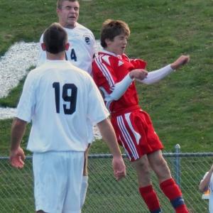 J.D. Souza goes up for the ball with St. Dom’s Zakary Johnson in the Western Maine quarterfinal on Wednesday. KATHY ONORATO/Wiscasset Newspaper 