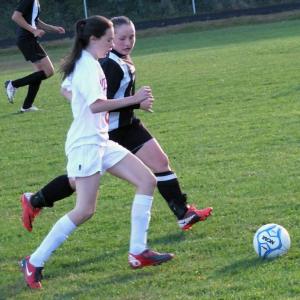 Freshman Kennedy Orr out runs a Lisbon defender to the ball. KATHY ONORATO/Wiscasset Newspaper   