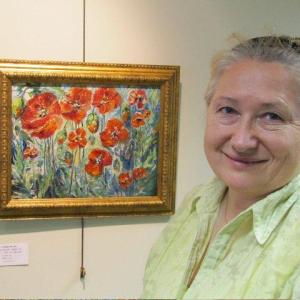 Svetlana Beattie shown with one of her paintings at the FIRST Bank in Boothbay Harbor. Svetlana Beattie shown with one of her paintings at the FIRST Bank in Boothbay Harbor.