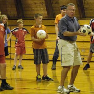 Jim Walsh demonstrates soccer drills to his Wiscasset Middle School gym class on Friday afternoon. KATHY ONORATO/Wiscasset Newspaper
Jim Walsh demonstrates soccer drills to his Wiscasset Middle School gym class on Friday afternoon. KATHY ONORATO/Wiscasset Newspaper