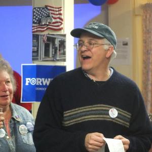 Mick Devin announces the first round of results at Lincoln Country Democrat headquarters in Damariscotta November 6. Below: Bruce MacDonald outside the Lincoln Country Democrat headquarters in Damariscotta. MacDonald continually checked for updates throughout the night. RYAN LEIGHTON/Boothbay Register Mick Devin announces the first round of results at Lincoln Country Democrat headquarters in Damariscotta November 6.