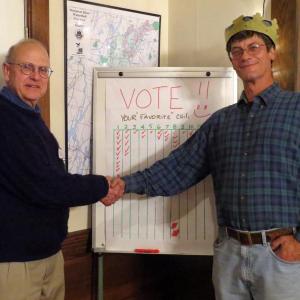 Board President John Atwood, left, congratulates John Wentzel, right, for winning the chili competition at the Sheepscot Valley Conservation Association November 9. Courtesy of Sheepscot Valley Conservation Association 