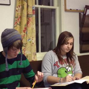 Wiscasset High School seniors Kyle Shute, left, and Annalisa Haase take notes at the December 13 Alna selectmen’s meeting. The two were there fulfilling a school requirement. SUSAN JOHNS/Wiscasset Newspaper