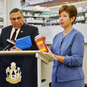 Patricia Aho, right, speaks at a recent event as Gov. Paul LePage watches. Courtesy of Maine DEP Patricia Aho, right, speaks at a recent event as Gov. Paul LePage watches.