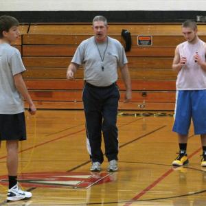 Coach Dana Lawrence, center, works on conditioning with J. D. Souza, left and Austin Haskell, right, at a recent practice. KATHY ONORATO/Wiscasset Newspaper Coach Dana Lawrence, center, works on conditioning with J. D. Souza, left and Austin Haskell, right, at a recent practice. KATHY ONORATO/Wiscasset Newspaper