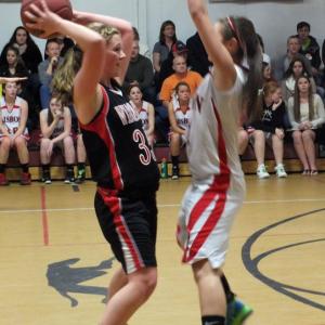 Kasey Cromwell looks to get rid of the ball. KATHY ONORATO/Wiscasset Newspaper 