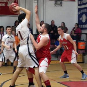 John Rines plays tough defense against Lisbon. KATHY ONORATO/Wiscasset Newspaper