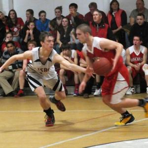 Austin Haskell drives past a Lisbon defender. Below: Kasey Cromwell looks to get rid of the ball during the girls' game. KATHY ONORATO/Wiscasset Newspaper Austin Haskell drives past a Lisbon defender. KATHY ONORATO/Wiscasset Newspaper