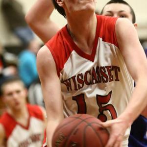 Wiscasset's Travis Padilla ties the game with Madison with two seconds left to send the game to overtime Saturday, Jan.19. Below: Dale Peaslee finishes a layup. Peaslee finished with 19 points. Courtesy of Brion Controvillas Wiscasset's Travis Padilla ties the game with Madison with two seconds left to send the game to overtime Saturday, Jan.19.