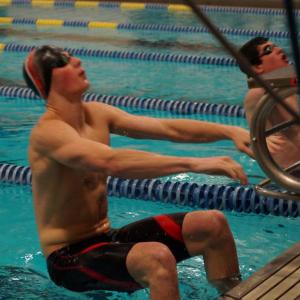Matt Mills gets set to compete in the boys’ 100-yard backstroke in a meet with Belfast on Friday, Jan. 25. Below: Alyssa Urquhart dives into competition with Belfast. Courtesy of John Anzalone Matt Mills gets set to compete in the boys’ 100-yard backstroke in a meet with Belfast on Friday, Jan. 25.