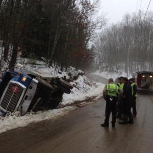 A Dead River Company fuel truck was in a ditch this morning in Alna as a tow truck driver worked to upright it. SUSAN JOHNS/Wiscasset Newspaper