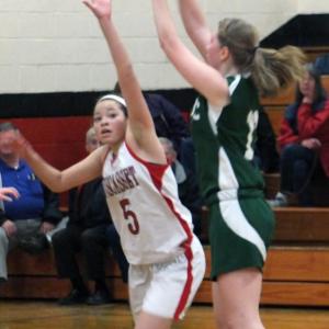 Tylan Onorato gets her hand in the face of a Carrabec shooter. Below: Brianna Goud ties up the ball. KATHY ONORATO/Wiscasset Newspaper Tylan Onorato gets her hand in the face of a Carrabec shooter.