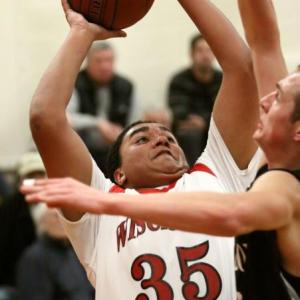 Dylan McMahon pulls down a rebound in Wiscasset’s game with St. Dom’s on Wednesday. Courtesy of Brion Controvillas
