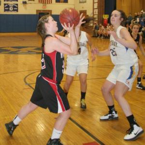 Kasey Cromwell gets an open look for a shot as Boothbay's Alex Clarke moves in to defend. Below: Heidi Pinkham tries to drive past Boothbay's Hannah Morley during the game at Boothbay Region High School February 7. KEVIN BURNHAM/Wiscasset Newspaper Kasey Cromwell gets an open look for a shot as Boothbay's Alex Clarke moves in to defend. KEVIN BURNHAM/Wiscasset Newspaper