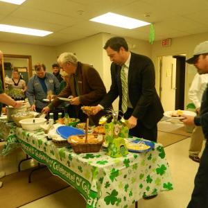 Guests line up along the buffet table to enjoy some traditional Irish food. CHARLOTTE BOYNTON/Wiscasset Newspaper