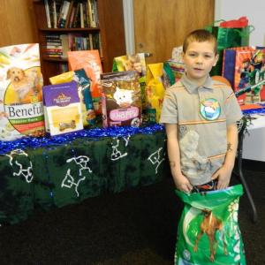 Woolwich central School Kindergartner Stone Medina, stands by his birthday presents at the Wiscasset Community Center this past Sunday. He requested that his friends bring cat and dog food, instead of presents for himself. He donated his gifts to the Lincoln County Animal Shelter. CHARLOTTE BOYNTON/Wiscasset Newspaper Woolwich central School Kindergartner Stone Medina, stands by his birthday presents at the Wiscasset Community Center this past Sunday. He requested that his friends bring cat and dog food, instead of presents for himself. He donated his gifts to the Lincoln County Animal Shelter. CHARLOTTE BOYNTON/Wiscasset Newspaper