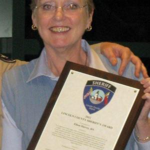 Eileen Harvey displays the special award she received from the Sheriff's Office. Courtesy of the Lincoln County Sheriff's Office