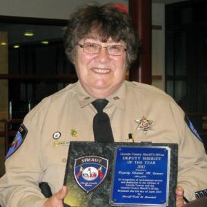 2012 Lincoln County Deputy of the Year, Deputy Eleanor Grover, proudly displays her award. Below: Eileen Harvey displays the special award she received from the Sheriff's Office. Courtesy of the Lincoln County Sheriff's Office 2012 Lincoln County Deputy of the Year, Deputy Eleanor Grover, proudly displays her award. Courtesy of the Lincoln County Sheriff's Office.