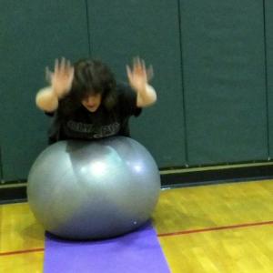 Rachael Fossett, above, and Cindy Carter, below, demonstrate the Superman exercise on the ball at the Week 5 Punishment Workout of Lisa Hall’s Weight Loss Challenge Monday, April 1. KATHY ONORATO/Wiscasset Newspaper