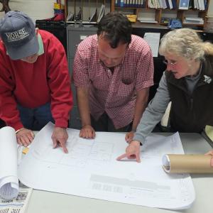 Woolwich Selectmen look over preliminary sketches of a proposed town office addition to be approved by voters at the annual town meeting May 8. From left are Lloyd Coombs, Jason Shaw and Allison Hepler. JOHN MAGUIRE/Wiscasset Newspaper