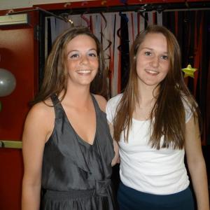 Student Council members Briana Goud and Sarah Hanley welcome students from four other high schools to the dance on April 26. Courtesy of Wiscasset High School