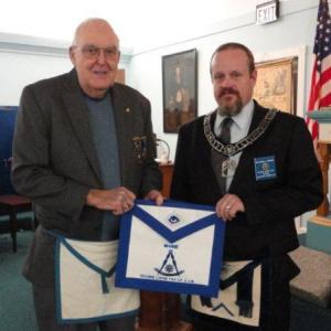 Merlin H. Gray, left, is presented his Life Member apron by Worshipful Mike Leighton. Below: Newest Master Mason Zachary Robert Barry and Lifetime Member Curtis W. West. Courtesy of Gary Tilton