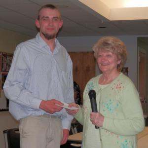Wiscasset senior Brandon Williams accepts the Wiscasset Senior Center Scholarship from selection committee member, Arlene Polewarczyk. Courtesy of Wiscasset Senior Center
