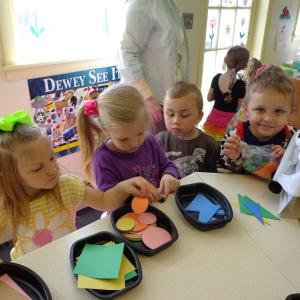 Story Time participants pick out shapes to take home and make pictures. Examples were demonstrated using the shapes. With collective imagination, houses, wagons, cars and more were created. Courtesy of Wiscasset Public Library 