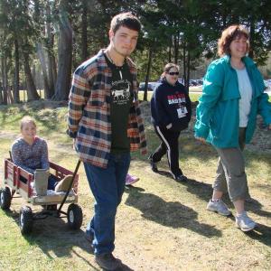 With help from brother Simeon Gray, Lewiston's Maddie Gray, in wagon, takes part in the Feed Our Scholars benefit in May 4. SUSAN JOHNS/Wiscasset Newspaper