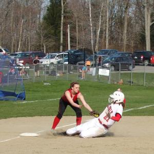 Heidi Pinkham puts a tag on Hall-Dale’s Emily Maynard on Monday, April 29. KATHY ONORATO/Wiscasset Newspaper