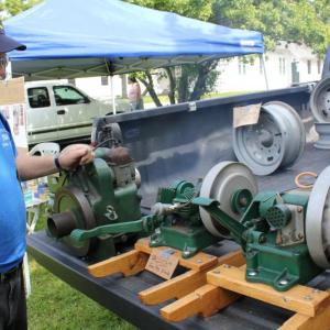 Elwin Plummer of Casco restored these antique washing machine engines. SUE MELLO/Boothbay Register