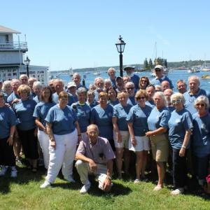 The 14th Biennial Island Packet Rendezvous took place in Boothbay Harbor from July 25-28 at Captain Fish’s and Boothbay Harbor Inns. The Island Packet crew, with Mary and Norm Pierce at center front, took a break for a group photograph on Saturday, staged in front of their yachts of choice anchored in the background.  SUE MELLO/Boothbay Register