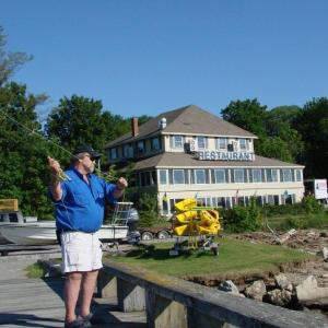 Forrest Faulkingham demonstrates a fishing technique at the Recreational Pier in Wiscasset. SUSAN JOHNS/Wiscasset Newspaper