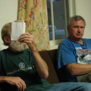 Behind this paper is Sheepscot Valley Regional School Unit board member Ralph Hilton of Alna, speaking at the August 22 Alna selectmen's meeting.  At right is Alna Road Commissioner Jeff Verney. SUSAN JOHNS/Wiscasset Newspaper