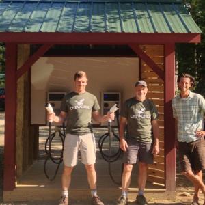 Showing off the new car charging station are, from left, Chewonki sustainability officer Tom Twist, technician Jamie Kane, and facilities manager Carob Arnold. Courtesy of Chewonki
