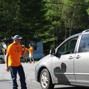 “Wings” volunteer Bryan Buck helps direct traffic near the Wiscasset Municipal Airport the morning of the event. Volunteers played a vital role in “Wings,” and next year, organizers hope to secure them sooner. SUSAN JOHNS/Wiscasset Newspaper