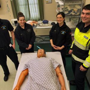 Standing in the Boothbay Region Ambulance Service simulation lab are, from left, Operations Manager and Paramedic Scott Lash, Paramedic Katie Hudson, Advanced Emergency Medical Technician Kerri Dupre and Emergency Medical Technician James Bodman. These Boothbay Region Ambulance Service members have pulled together to better practice their skills. Courtesy of LincolnHealth