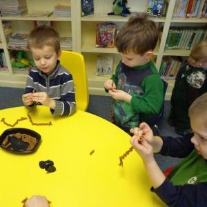 J.J., Dean and Josh are concentrating on making pasta worms. Courtesy of Wiscasset Public Library